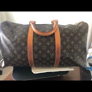 Auth Louis Vuitton overnight duffle bag